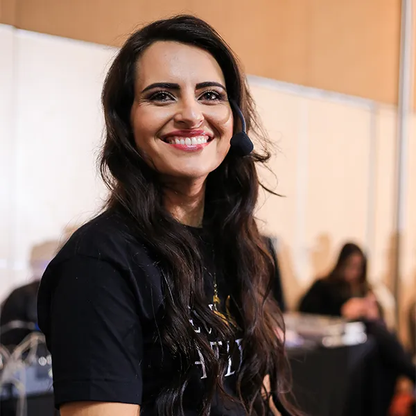 Coach Mayra Ramos smiling at a training event